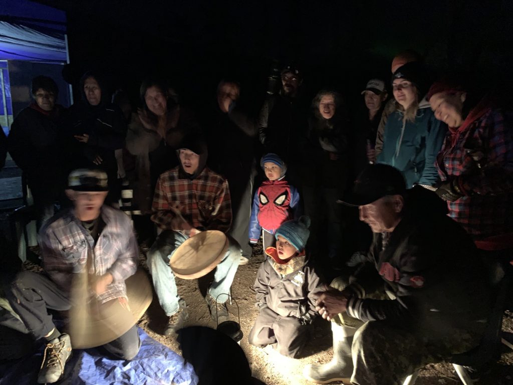 Community members and visitors to Sayisi Dene First Nation participate in hand games at the Tadoule Lake Stewardship Summit in September 2019 (Credit: Mira Oberman, CPAWS)