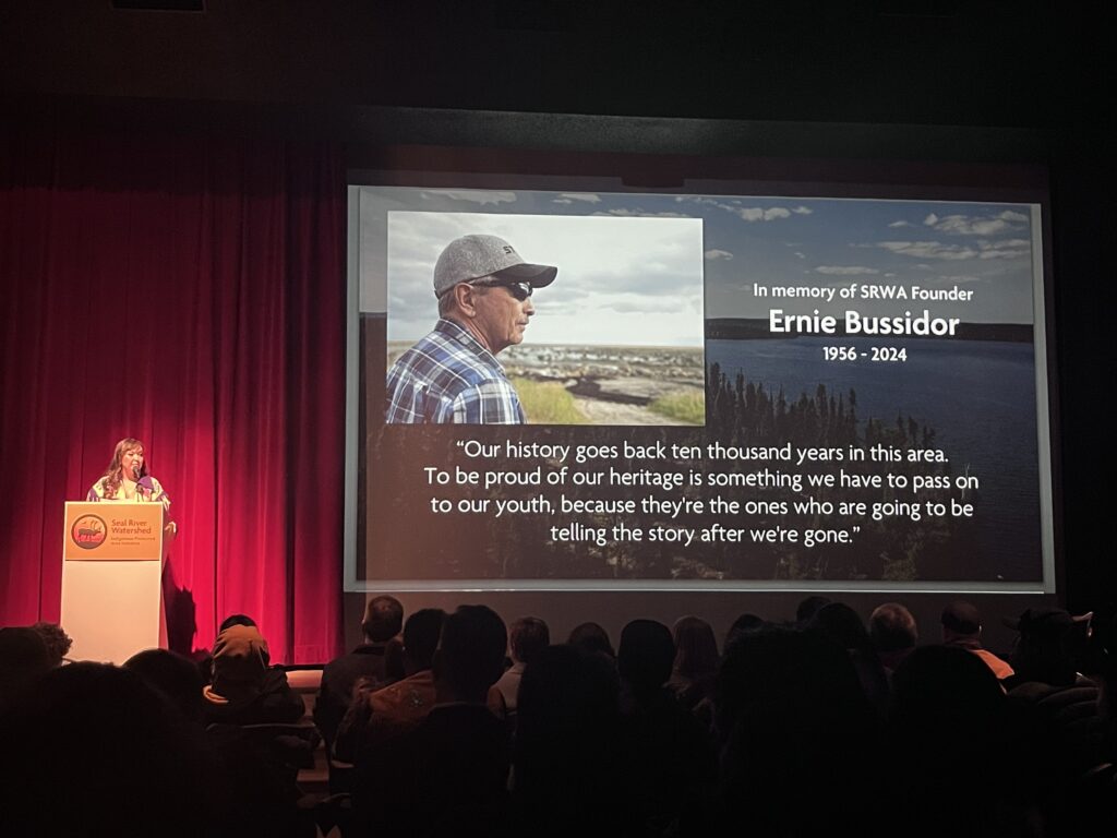 Seal River Watershed Alliance Executive Director Stephanie Thorassie honours Ernie Bussisdor at a documentary film premiere in March 2024. Credit Mira Oberman