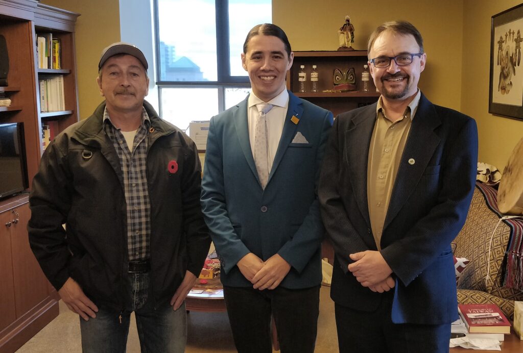 Ernie Bussidor (L) and Ron Thiessen (R) meet with MLA Robert Falcon Oulette in Ottawa in October 2018.