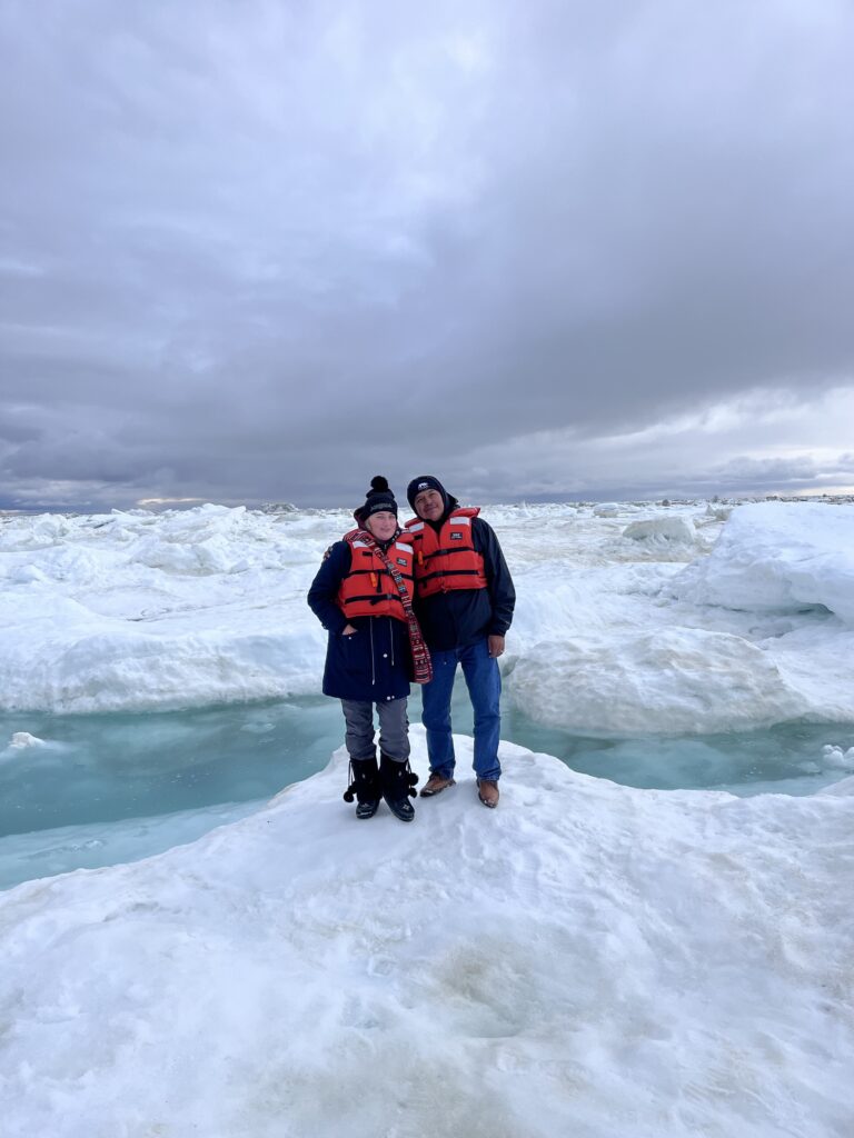 Robben Constant of York Factory First Nation and his wife Annie Constant explore an ice floe in Hudson Bay near Churchill in June 2024. Credit Mira Oberman, CPAWS Manitoba