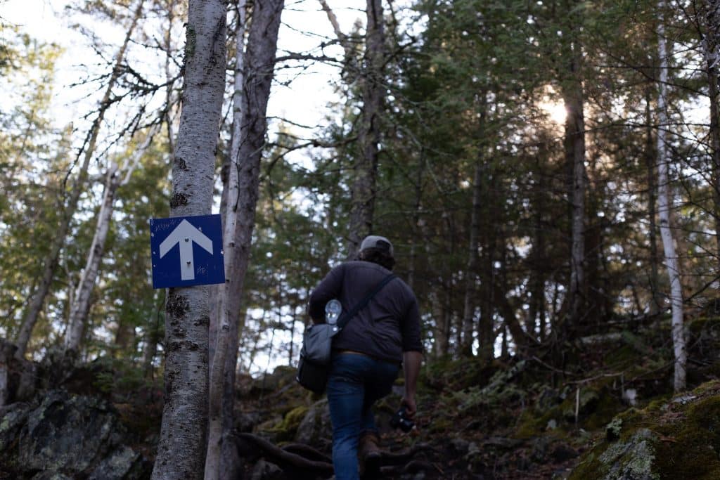 Man walking on Hunt Lake Trail at Whiteshell Provincial Park (Riley Martin)